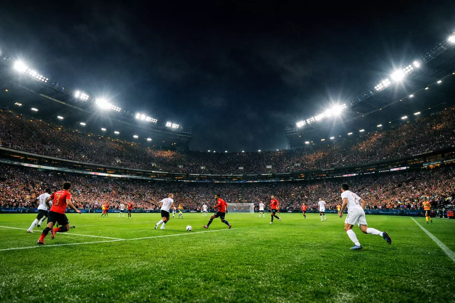 Voetbalwedstrijd in avondstadion met felle verlichting